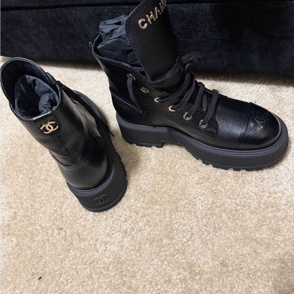 CHANEL Black Combat Boots with Gold Accents